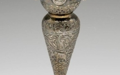 A white metal vase of Indian style, the circular