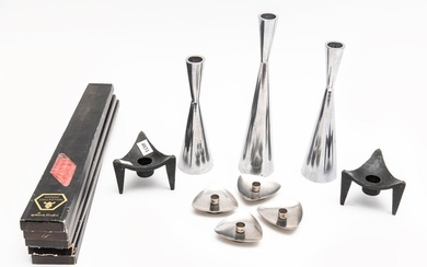 A COLLECTION OF METAL CANDLEHOLDERS WITH FIVE BOXES OF NORDIC TAPERS