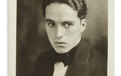 CHAPLIN, CHARLIE. Photograph Signed and Inscribed, "Faithfully / Chas Chaplin," bust portrait showing...