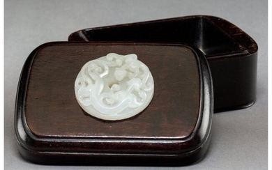 78031: A Chinese White Jade Disk Set in a Hardwood Box