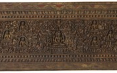 A GILT-WOOD AND POLYCHROME BOOK COVER Tibet, 14th/15th Century