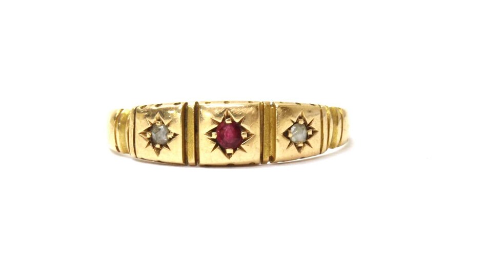 A 15ct gold ruby and diamond three stone ring