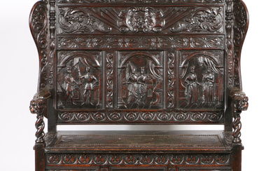 A 19TH CENTURY OAK SETTLE IN THE 17TH CENTURY MANNER.