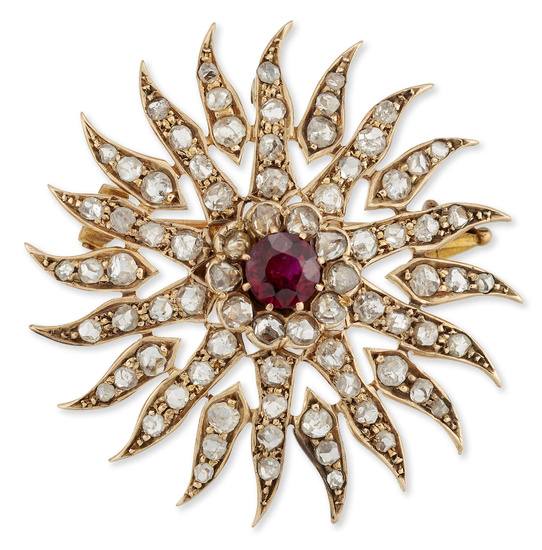 A 19th century gold, ruby and diamond sunburst brooch/pendant, the...