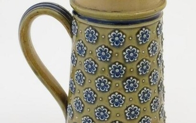 A 19thC Doulton Lambeth jug decorated with flowers in