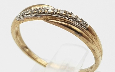 A 9K Yellow Gold Diamond Crossover Ring. Size M....