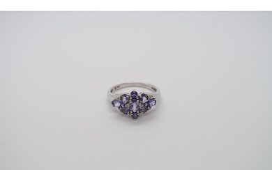 A 9ct white gold tanzanite and diamond ring, head size appro...