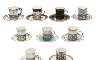 A COLLECTION OF SILVER MOUNTED PORCELAIN COFFEE CANS AND SAUCERS.