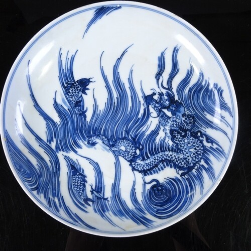 A Chinese blue and white porcelain dish, with painted dragon...