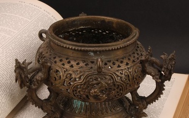 A Chinese bronze hanging censer, pierced and cast with drago...