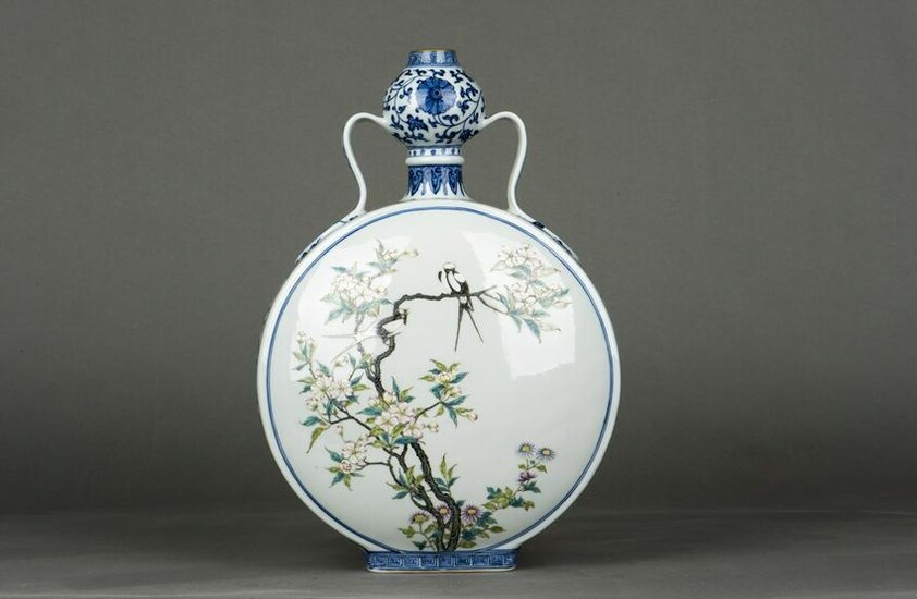 A Chinese underglaze Blue and Famille- rose Enameled