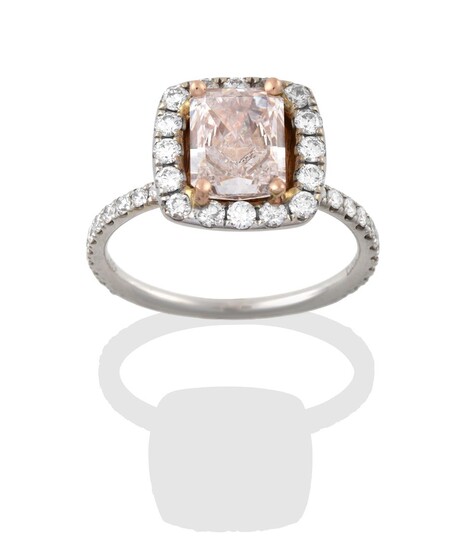 A Diamond Cluster Ring, the central fancy light brownish-pink emerald-cut diamond, in yellow...