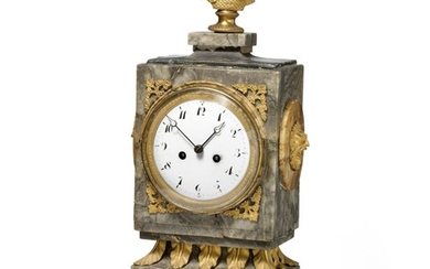 A French Directoire marble and gilt bronze mantel clock with white enamel dial. C. 1800. H. 48 cm. W. 21 cm. D. 13 cm.