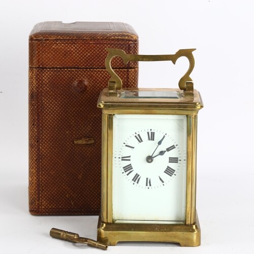 A French brass-cased carriage clock, white enamel dial with ...