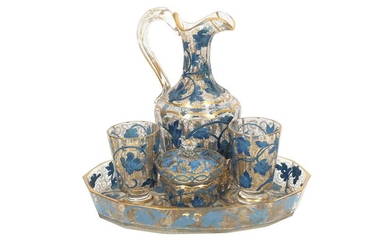 A GILT AND BLUE-PAINTED TRANSPARENT GLASS DRINKING SET MADE FOR THE MIDDLE EASTERN MARKET Possibly France or Bohemia, Czech Republic, early 20th century