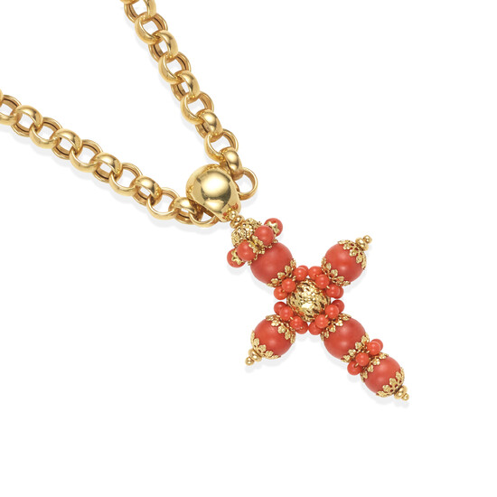 A GOLD AND CORAL CROSS PENDANT ON A GOLD CHAIN