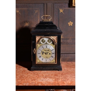A George I gilt metal mounted ebonised table clock