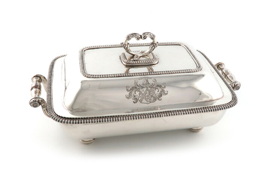 A George III silver entrée dish and cover on an old Sheffield plated warming stand