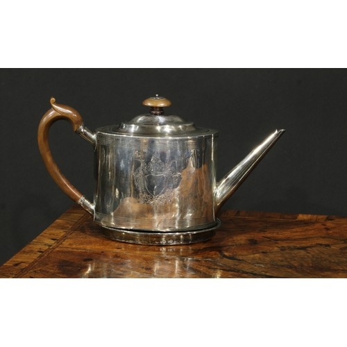 A George III silver oval drum shaped teapot, bright-cut and ...