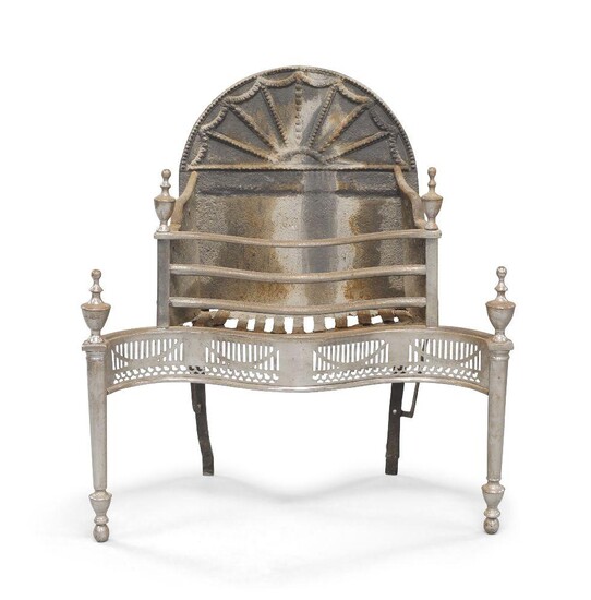 A George III style cast iron and steel fire grate, the arch back with beaded fan design, serpentine front with pierced apron and urn shape finials, raised on cylindrical supports, 84cm high, 77cm wide, 37cm deep