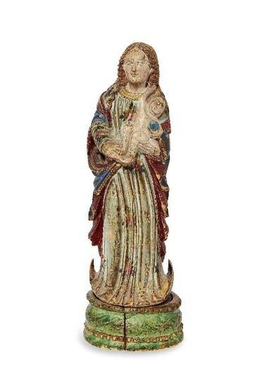 A Goanese polychrome ivory figure of the Virgin and Child, late 17th century, the Child depicted cradled in both hands and holding a sphere, standing on a crescent moon, with integral oval base, 22cm high Provenance: The Geoffrey and Fay Elliot...