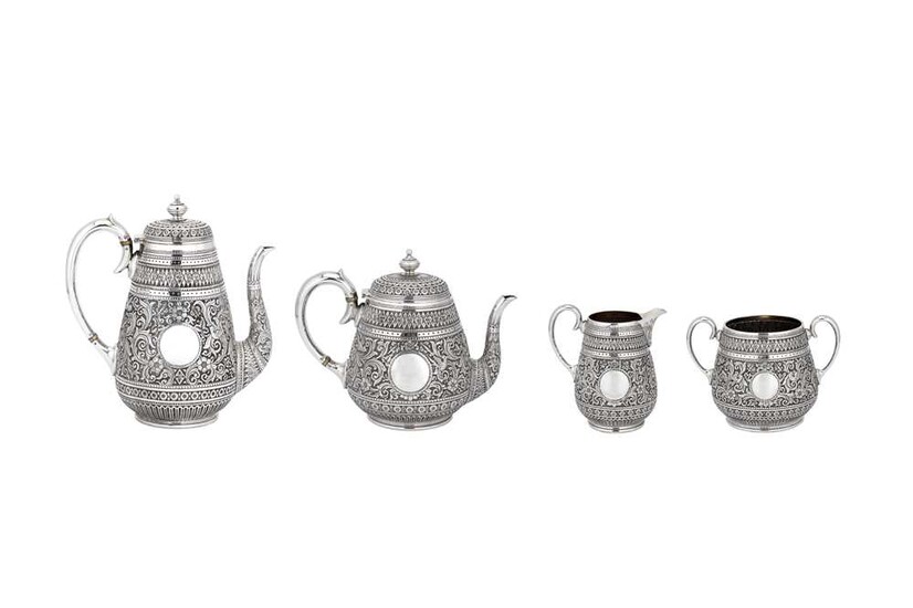 A LARGE VICTORIAN INDIAN STYLE STERLING SILVER TEA AND COFFEE SERVICE London, England, 1899, by Holland, Aldwinckle & Slater