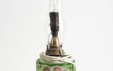 A LATE VICTORIAN KEROSENE LAMP, WITH AN ENAMELLED GREEN GLASS FONT AND A CAST IRON BASE, H.53CM, LEONARD JOEL LOCAL DELIVERY SIZE: S...