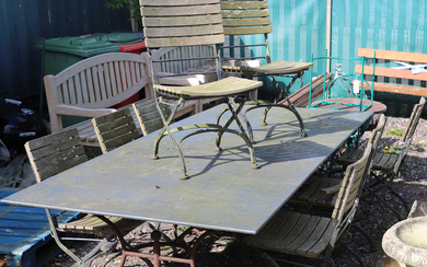 A METAL TOPPED WROUGHT IRON GARDEN TABLE AND 8 FOLDING CHAIRS.