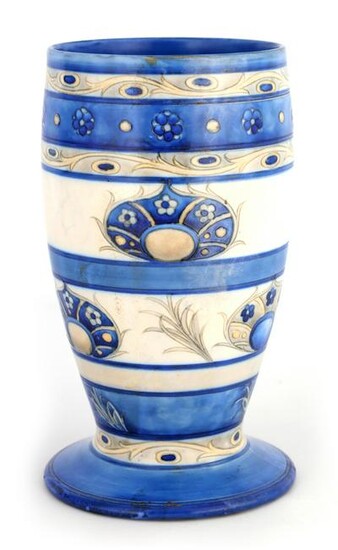 A MOORCROFT FOOTED OVOID VASE decorated in the ban