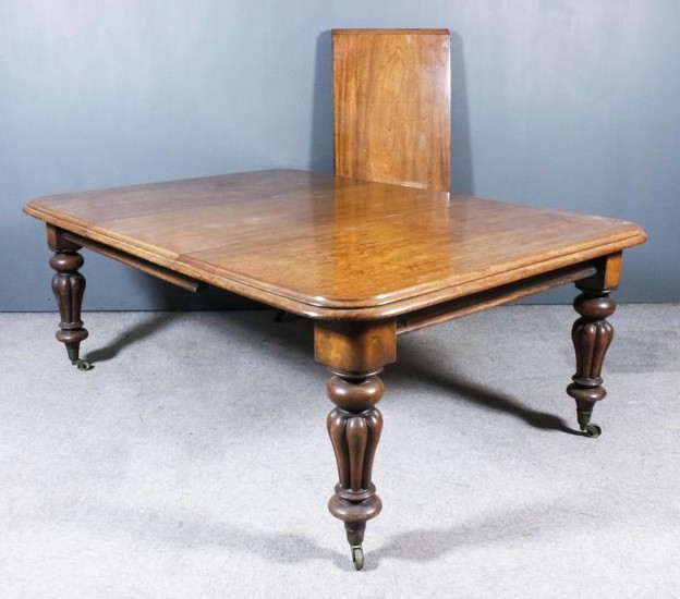 A Mahogany Rectangular Extending Dining Table, Victorian, with three...