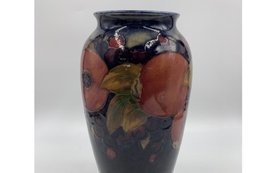 A Moorcroft Pomegranate pattern vase - approx. 25cm high