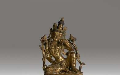 A Nepalese or Tibetan gilt copper alloy figure of a