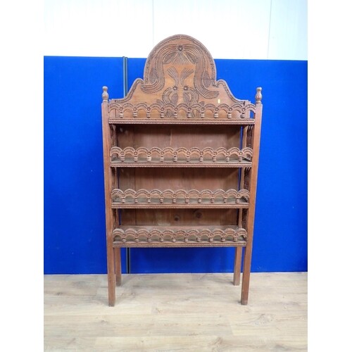 A North African pine set of carved Shelves with shaped surmo...