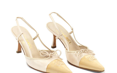 A PAIR OF BEIGE PATENT AND LAMBSKIN KITTEN HEELS Chanel