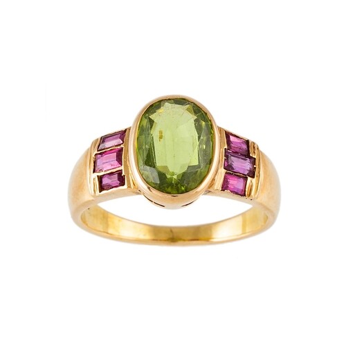 A PERIDOT SINGLE STONE RING, to ruby shoulders, mounted in y...