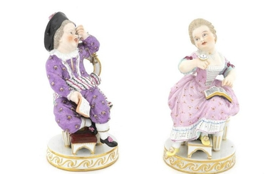 A Pair of Meissen Porcelain Figures of a Seated Boy and