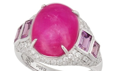 A RUBY, PINK SAPPHIRE AND DIAMOND BOMBE RING in 18ct white gold, set with a cabochon ruby of 10.80