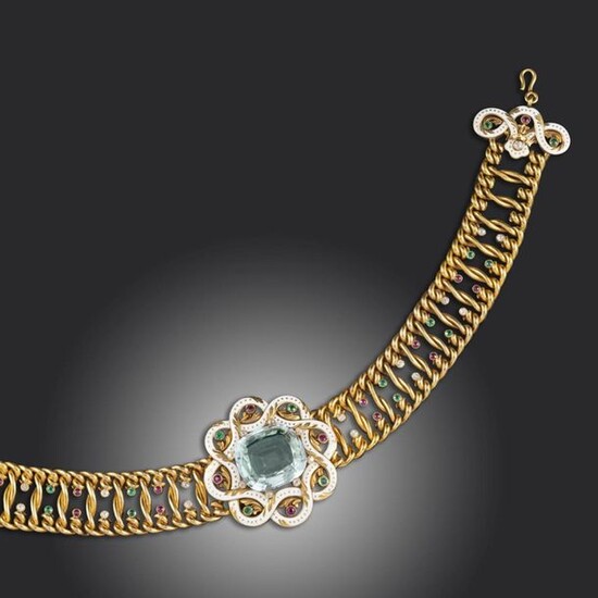 A Renaissance Revival diamond, multi-gem and enamel choker by A.E Köchert, the central cushion-shaped blue topaz mounted within a twisted enamel surround, accented by old-cut diamond and circular-cut multi-gem collets to the similarly-set entwined...