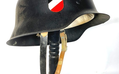 A Replica WWII German Black Helmet with Crest Detail & Leather Strap