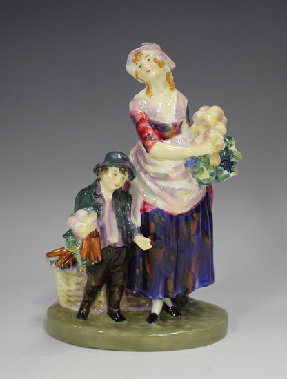 A Royal Doulton figure of London Cry, HN752, designed by L. Harradine, height 17.5cm.