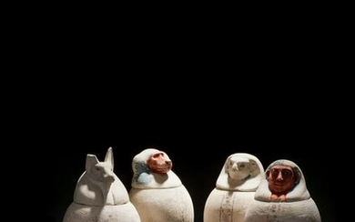 A Set of Four Egyptian Painted Limestone Canopic Jars