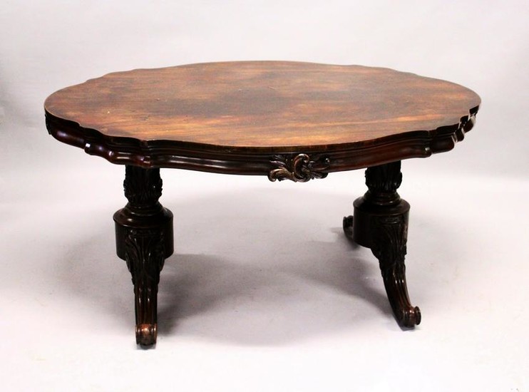 A VICTORIAN ROSEWOOD LIBRARY TABLE, with a shaped top