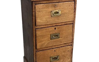 A Victorian mahogany three drawer bedside chest, adapted, wi...