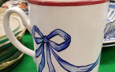 A Wemyss "Blue Bow" decorated quart mug for the...