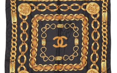 A black and gold scarf, Chanel paris the black...