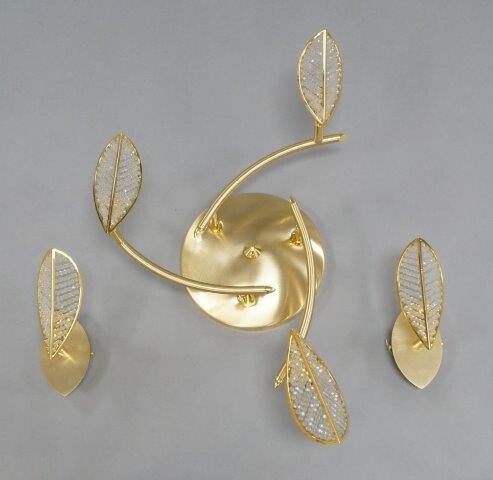 A brass three light ceiling light and two matching wall lights, of recent manufacture, with stylised leaf form and faceted bead diffusers (3) It is the buyer's responsibility to ensure that electrical items are professionally rewired for use.