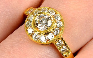 A brilliant-cut diamond cluster ring.