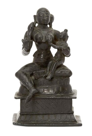 A bronze figure of Yashoda with Krishna,...