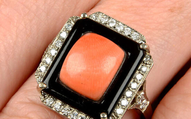 A coral, onyx and diamond dress ring.