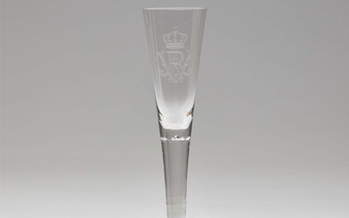 A cut glass champagne flute with the imperial monogram